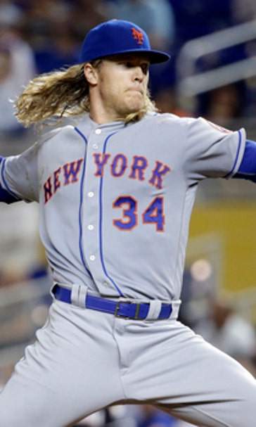 Mets help playoff chances by beating mourning Marlins 12-1